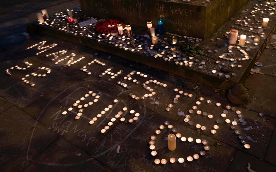 Candles were laid at the vigil a week on from the attack - Credit: Jon Super /AFP