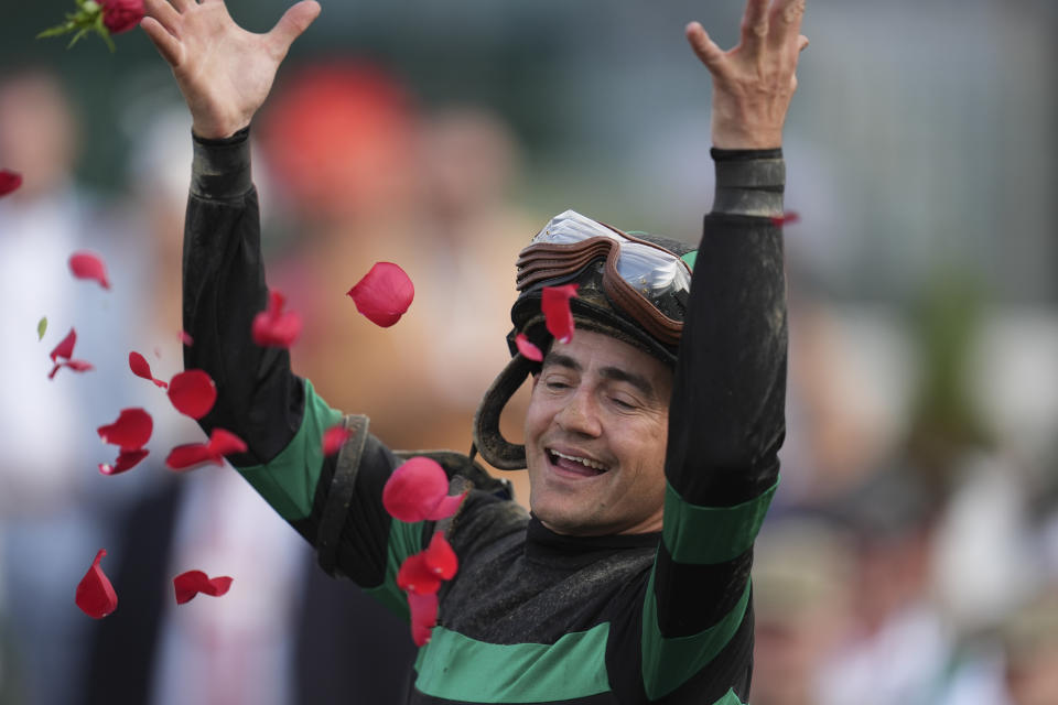 Brian Hernandez Jr. celebrates in the winner's circle after riding Mystik Dan to win the 150th running of the Kentucky Derby horse race at Churchill Downs Saturday, May 4, 2024, in Louisville, Ky. (AP Photo/Abbie Parr)