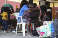 A Haitian migrant rests his head on a backpack at the Padre Infante shelter, in Monterrey, Mexico, Wednesday, Sept. 22, 2021. (AP Photo/Roberto Martinez)