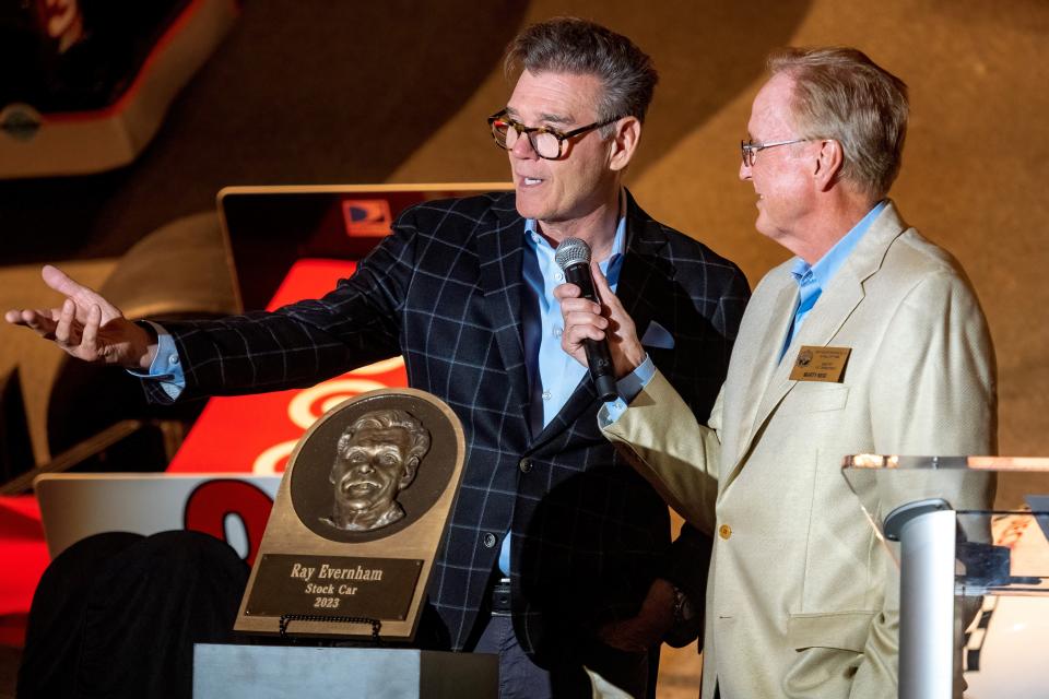 Ray Evernham (left) speaks during a ceremony honoring the 2023 inductees into the Motorsports Hall of Fame on Monday.