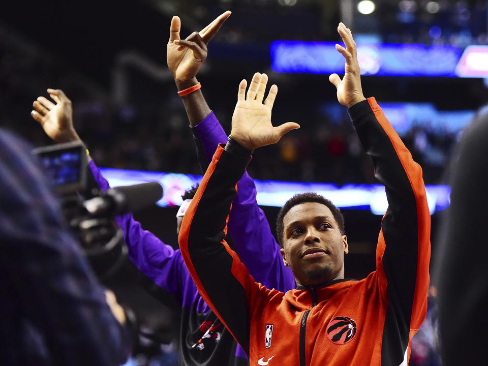 Toronto Raptors guard Kyle Lowry acknowledges the cheering crowd after he became the franchise leader in assists, during the second half of the team's NBA basketball game against the Atlanta Hawks on Tuesday, Jan. 28, 2020, in Toronto. (Frank Gunn/The Canadian Press via AP)
