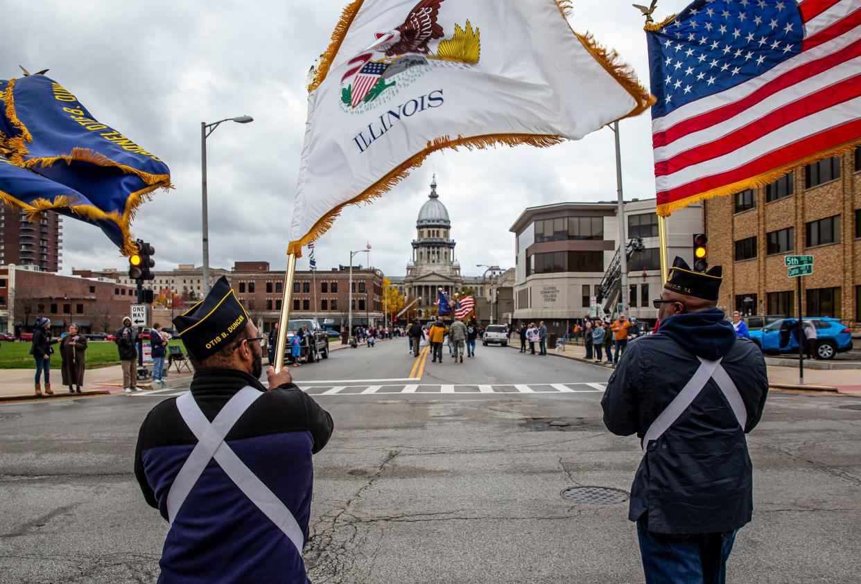 Members of the Otis B. Duncan American Legion Post #809, march down Capitol Avenue during the Veterans Day Parade in Springfield, Ill., Thursday, November 11, 2021. [Justin L. Fowler/The State Journal-Register] 