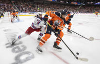 New York Rangers' Mika Zibanejad (93) vies for the puck against Edmonton Oilers' Darnell Nurse (25) during the third period of an NHL hockey game Friday, Nov. 5, 2021, in Edmonton, Alberta. (Jason Franson/The Canadian Press via AP)