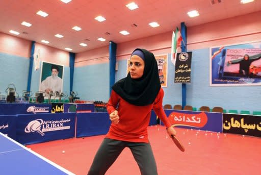 Neda Shahsavari, Iran's first woman to compete in table tennis at the Olympics, practises in Tehran on July 9.. Shahsavari, says she is "thrilled" to be going to the London Games, and dreams of winning a medal for the Islamic republic