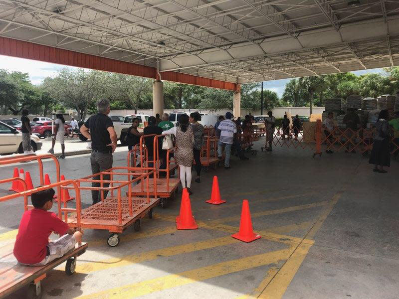 Fort Lauderdale-area residents line up for sheets of plywood at a&nbsp;Home Depot as they prepare for the arrival of Hurricane Irma on Wednesday. (Photo: Daniel Fox/HuffPost)