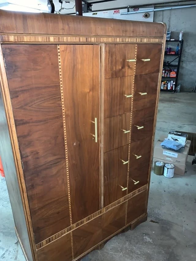 The cabinet after with the original wood pattern and brass handles