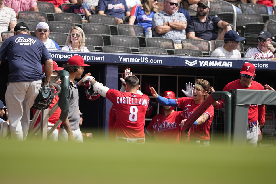 Philadelphia Phillies' Nick Castellanos (8) celebrates after hitting a solo home run in the second inning of a baseball game against the Atlanta Braves, Wednesday, Sept. 20, 2023, in Atlanta. (AP Photo/Brynn Anderson)