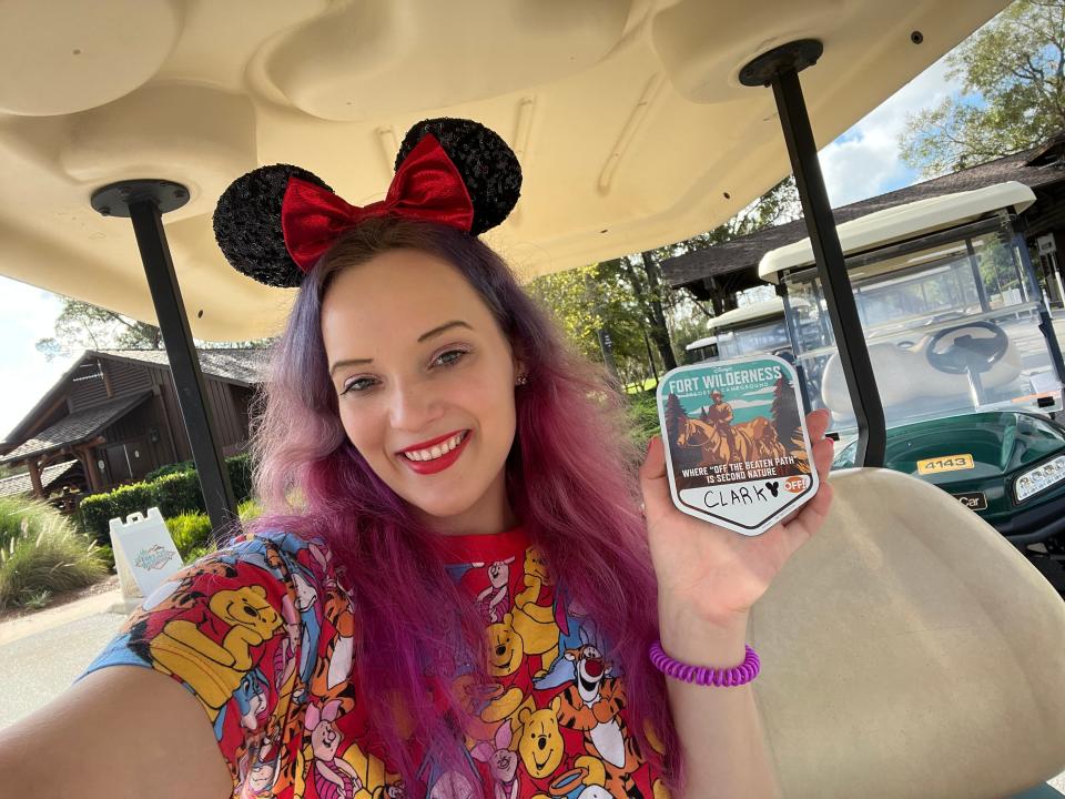 jenna clark holding magnet in golf cart