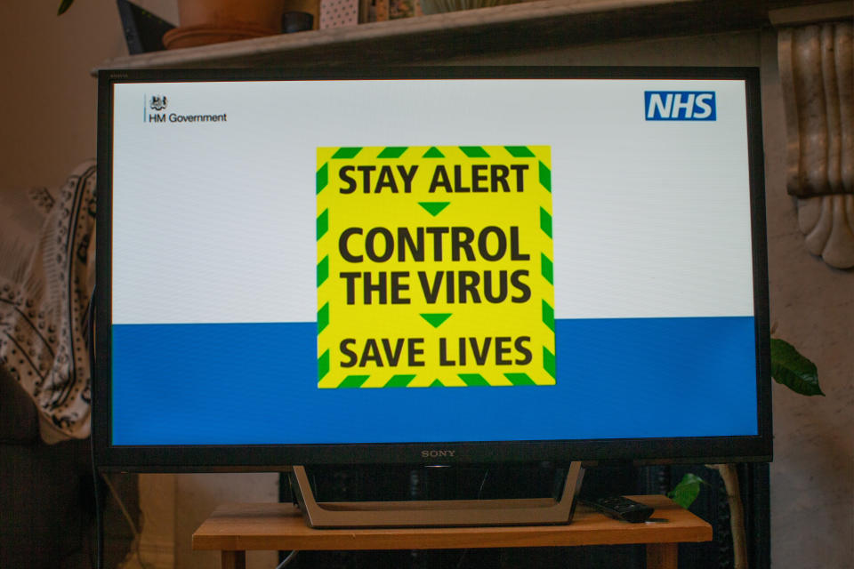 A message reading “Stay alert. Control the virus. Save lives” is screened on a TV in a home in north London during the Prime Minister Boris Johnson message to the nation about coronavirus (COVID-19) from 10 Downing Street, London. Picture date: Sunday May 10, 2020 