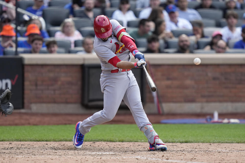 St. Louis Cardinals' Nolan Arenado hits a solo home run during the ninth inning of a baseball gam against the New York Mets at Citi Field, Sunday, June 18, 2023, in New York. (AP Photo/Seth Wenig)