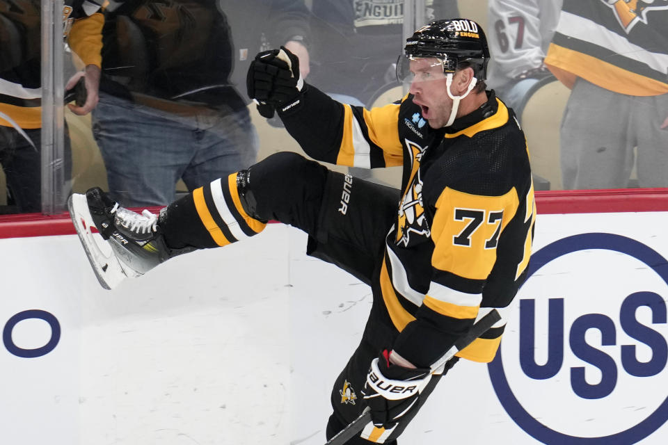 Pittsburgh Penguins' Jeff Carter (77) celebrates his short-handed goal against Arizona Coyotes goaltender Connor Ingram during the first period of an NHL hockey game in Pittsburgh, Tuesday, Dec. 12, 2023. (AP Photo/Gene J. Puskar)