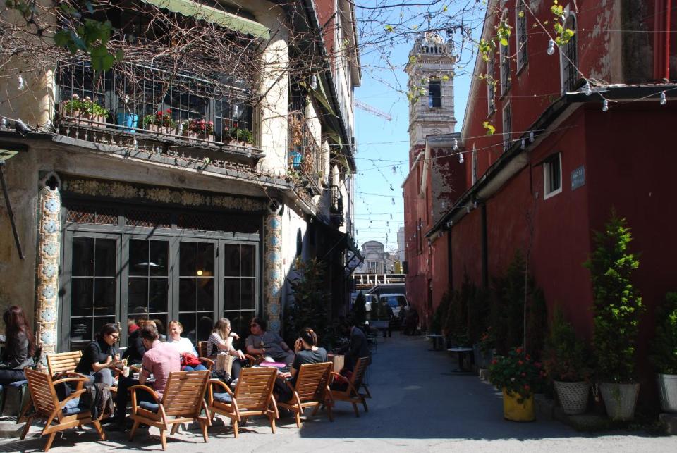 This undated image shows a cluster of small cafes in the Istanbul neighborhood of Karakoy, a neighborhood of Istanbul, Turkey, near a small church and galleries. While Istanbul is known for mosques and bazaars, it also offers many interesting neighborhoods for visitors to explore, like Karakoy, an up-and-coming area hemming the Bosporus Strait. (AP Photo/Sisi Tang)