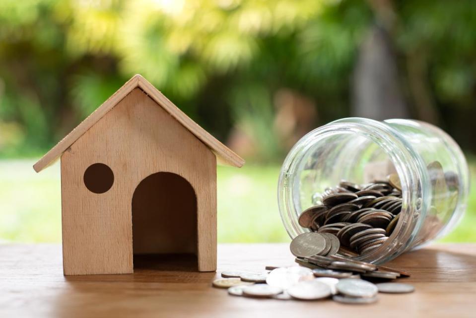 Wooden miniature house and money jar