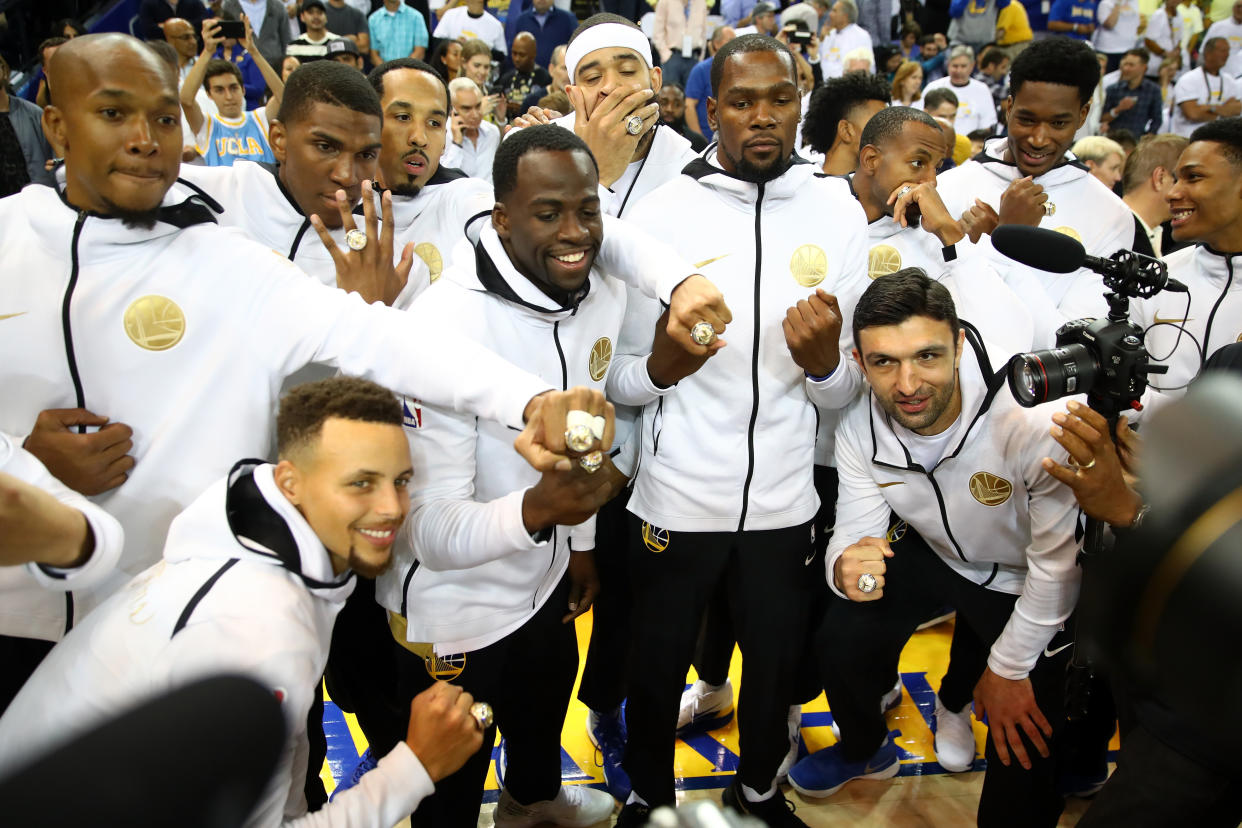 OAKLAND, CA – OCTOBER 17: The Golden State Warriors display their 2017 NBA Championship rings prior to their NBA game against the Houston Rockets at ORACLE Arena on October 17, 2017 in Oakland, California. NOTE TO USER: User expressly acknowledges and agrees that, by downloading and or using this photograph, User is consenting to the terms and conditions of the Getty Images License Agreement. (Photo by Ezra Shaw/Getty Images)