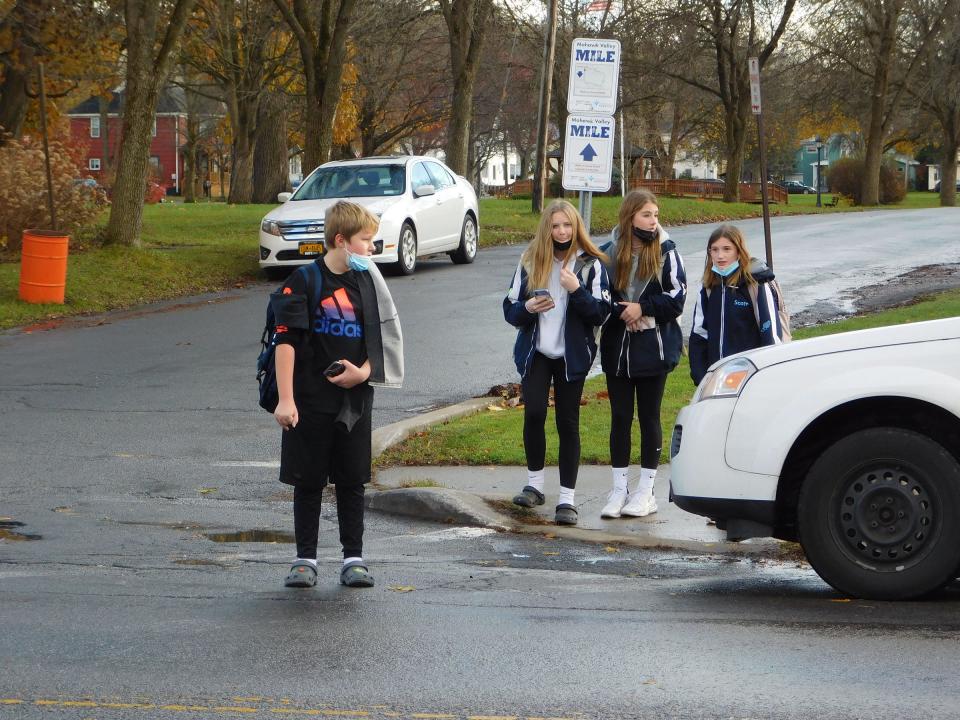 Jarvis Middle School students wait to cross Main Street at the end of the school day. The village police department has been looking for a crossing guard for that intersection since summer.