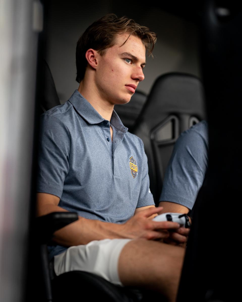 NHL top draft prospect Connor Bedard tries out a game while visiting the EA Sports NHL 23 World Championship at Walk of Fame Park in Nashville, Tenn., Tuesday, June 27, 2023.