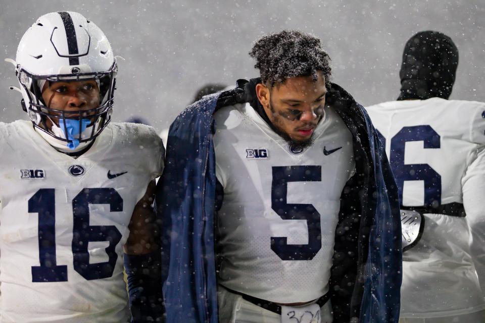 Nov 27, 2021; East Lansing, Michigan, USA; Penn State Nittany Lions cornerback Tariq Castro-Fields (5) and safety Ji'Ayir Brown (16) walk off the field after the game against the Michigan State Spartans at Spartan Stadium. Mandatory Credit: Raj Mehta-USA TODAY Sports