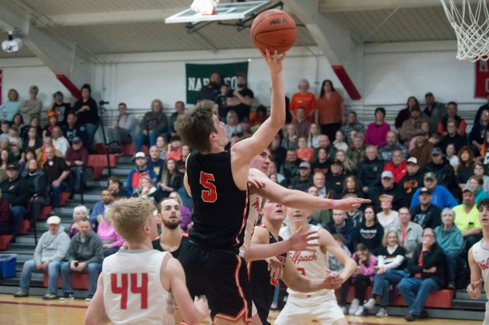 Comet junior Warrick Elder (5) scored 15 points for Jonesville in their regional semifinal game against Laingsburg.