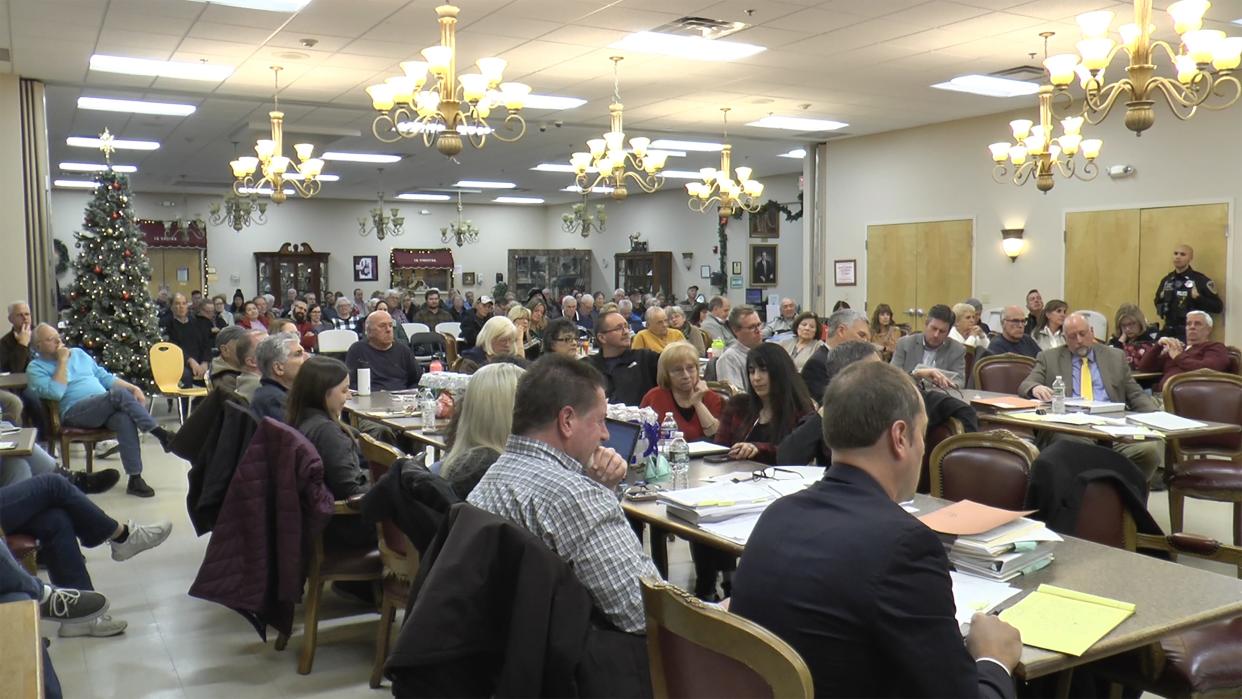 Opponents of the Green Development solar farm pack a November meeting of the Johnston Zoning Board.