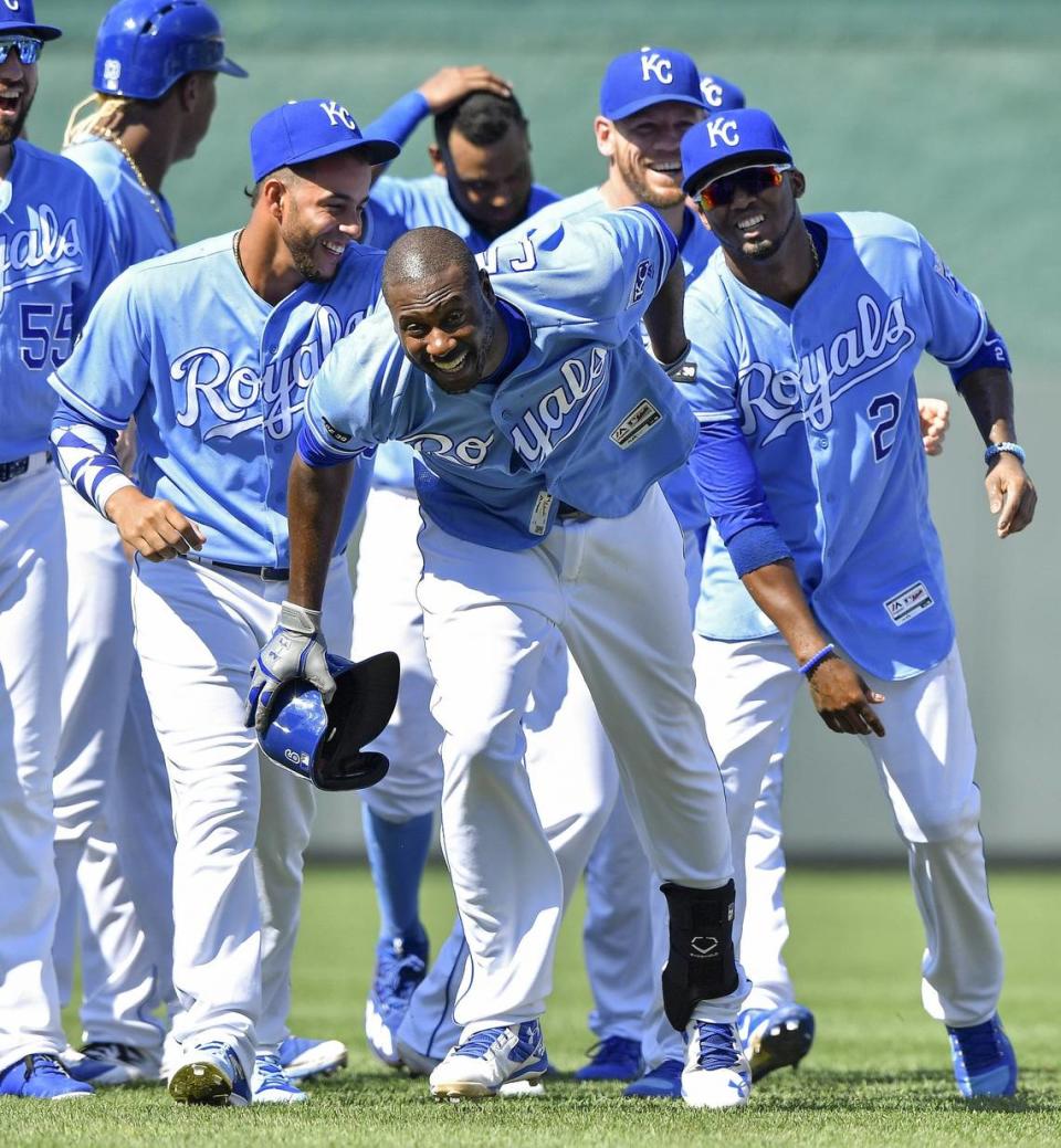 Kansas City Royals’ Lorenzo Cain runs from the team after the celebration following Cain’s game winning hit that was lost in the sun by Texas Rangers right fielder Shin-Soo Choo to score Alex Gordon in the ninth inning during a game at Kauffman Stadium in Kansas City, Mo.