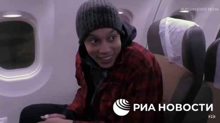 In a video released by Russian media, newly freed WNBA star Brittney Griner remarked, “I’m good,” as she sat in the airplane on her way home. Asked how she was feeling, she replied, “I’m happy.” (Photo: Screenshot/YouTube.com/ABC News)