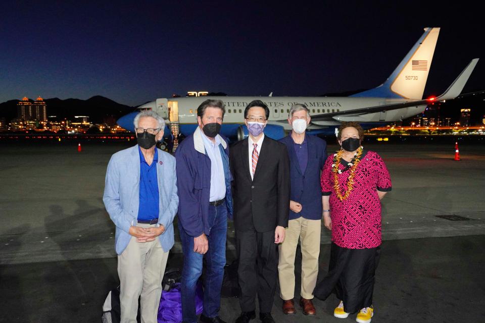 In this photo released by the Taiwan Ministry of Foreign Affairs, from left, U.S. Democratic Rep. Alan Lowenthal of California, Democratic Rep. John Garamendi, Donald Yu-Tien Hsu of Taiwan's Ministry of Foreign Affairs, Democratic Rep. Don Beyer from Virginia and Republican Rep. Aumua Amata Coleman Radewagen, a delegate from American Samoa, pose for a photo after arriving on Aug. 14, 2022, a U.S. government plane at Songshan airport in Taipei, Taiwan.