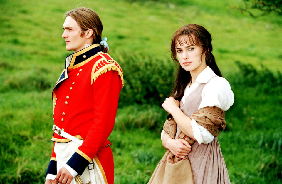 Rupert Friend and Keira Knightley stand in a field together