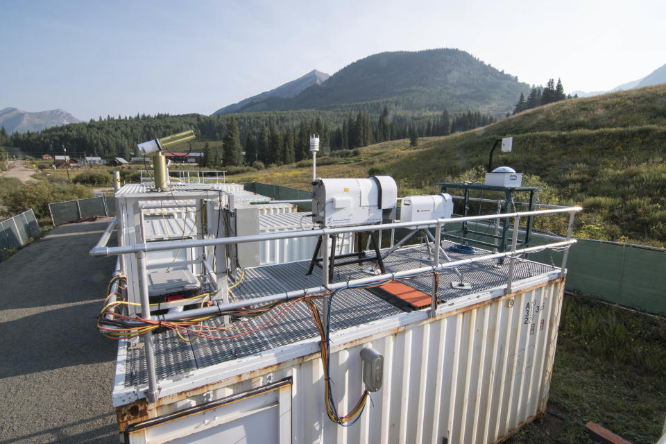 This Aug. 17, 2021 photo provided by Lawrence Berkeley National Laboratory shows Atmospheric Radiation Measurement instruments that will collect data from September to June 2023 during the Surface Atmosphere Integrated Field Laboratory (SAIL) campaign in Gothic, Colorado. The SAIL campaign will provide insights into mountainous water-cycle processes. Federal scientists are launching an effort to better understand the hydrology in the U.S. West. The U.S. Department of Energy on Tuesday, Aug. 24 announced a new kind of climate observatory near the headwaters of the Colorado River. (David Chu/Lawrence Berkeley National Laboratory via AP)