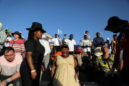 Christian pilgrims and tourists react during a religious retreat lead by T.B. Joshua, a Nigerian evangelical preacher on Mount Precipice, Nazareth