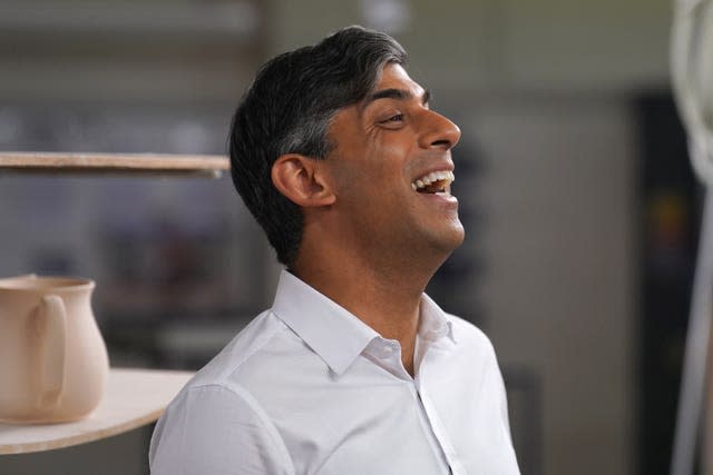 Prime Minister Rishi Sunak laughing