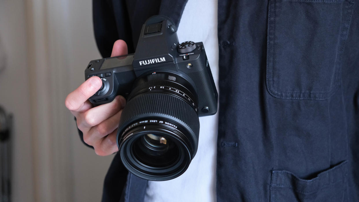  Fujifilm GFX 100 II camera in a hand. 