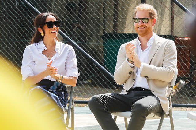 <p>Andrew Esiebo/Getty</p> Meghan Markle and Prince Harry visit Giants of Africa at Ilupeju Senior Grammar School on May 12, 2024 in Lagos, Nigeria.