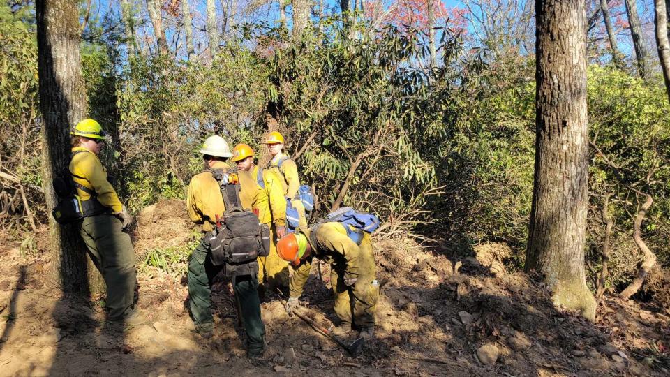 Firefighters get prepared as they get ready to battle the Poplar Drive Fire on Nov. 8.