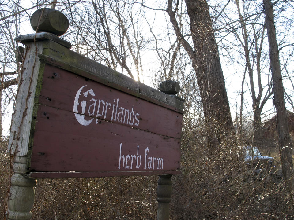 FILE - This Jan. 2, 2019 photo shows a sign that directs visitors to the Caprilands herb farm of the late famed herbalist Adelma Grenier Simmons in Coventry, Conn. An appeals court has temporarily stopped the eviction of Cook, the widower of famed herbalist Adelma Grenier Simmons from her once-acclaimed Connecticut farm after agreeing to hear his case. The state Appellate Court issued the ruling Wednesday, Jan. 16,just four days before the deadline set by a lower court judge forCook to leave the Coventry farm and remove animals and other items. (AP Photo/Dave Collins, File)