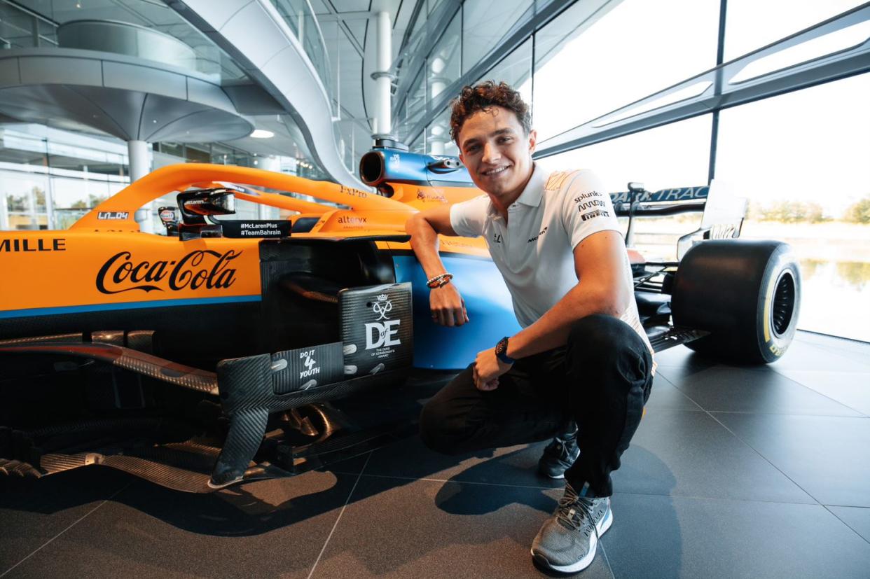 McLaren driver Lando Norris shows off the Duke of Edinburgh’s Award logo on his team’s car (Duke of Edinburgh’s Award)