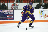 FILE - In this Dec. 15, 2018, file photo, Minnesota State defenseman Connor Mackey (2) skates with the puck against the Bowling Green during an NCAA college hockey game in Bowling Green, Ohio. Mackey, a top college free agent, signed with the Calgary Flames last week. (AP Photo/Rick Osentoski, File)