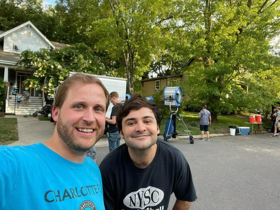 Nick Tosco poses on his NoDa street with Please Don’t Destroy’s John Higgins during filming of “Please Don’t Destroy: The Treasure of Foggy Mountain” in 2022.