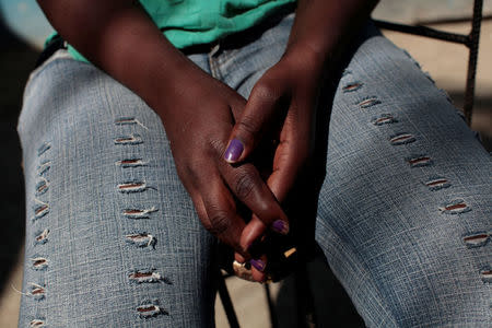 The hands of Marieline Jean, who was deported back to Haiti from the United States, are seen as she poses for a portrait at the house where she lives, in Port-au-Prince, Haiti, January 30, 2017. Picture taken January 30, 2017. REUTERS/Andres Martinez Casares