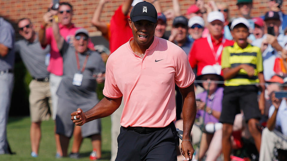 Tiger Woods reacts after making a putt for eagle. (Photo by Kevin C. Cox/Getty Images)