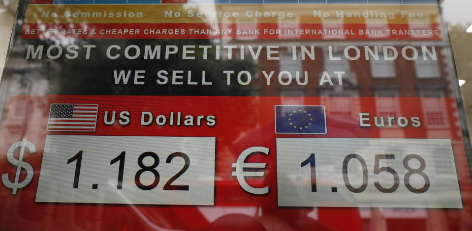 A currency exchange bureau displays the value of the British pound sterling against the United States dollar, left and the euro on a main shopping street in London, Tuesday, July 30, 2019. The pound has fallen sharply in recent days as businesses warn that no amount of preparation can eliminate the economic damage if Britain crashes out of the 28-nation trading bloc without agreement on the terms. The currency fell early Tuesday to $1.2120, its lowest since March 2017. (AP Photo/Alastair Grant)