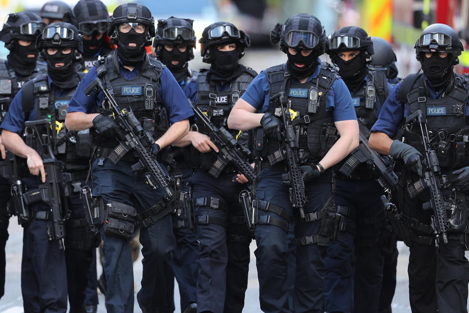 Counterterrorism officers march near the scene of a terrorist attack on London Bridge.&nbsp;