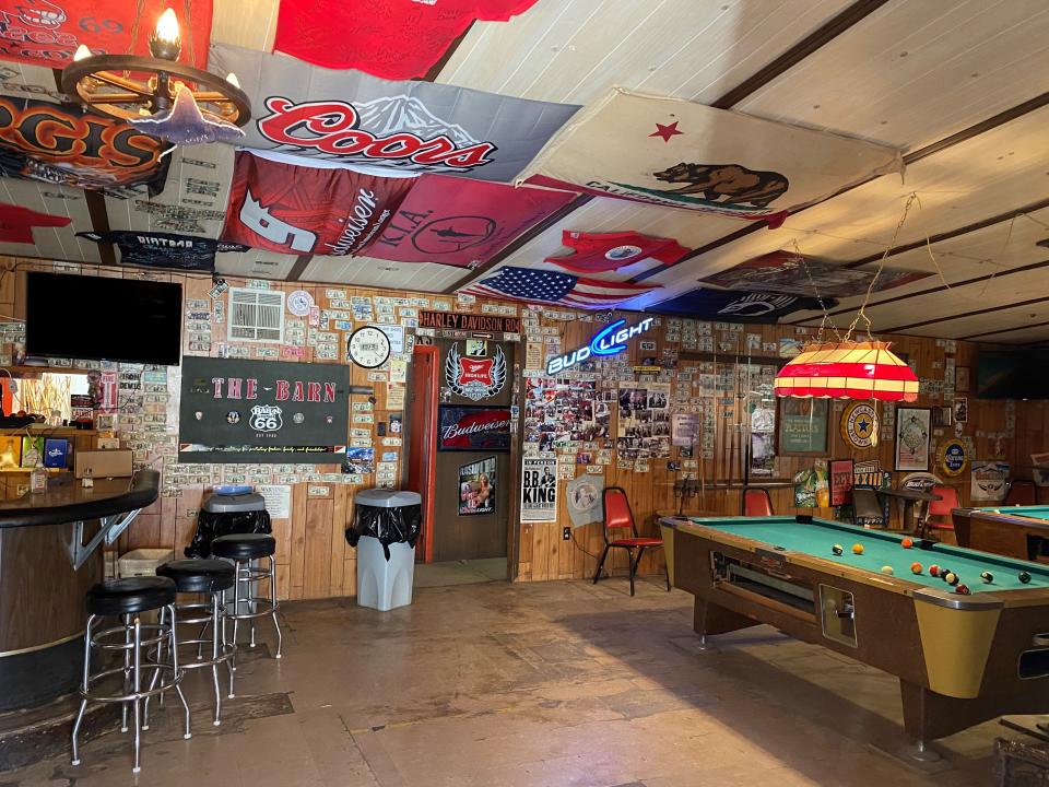 Joel heard footsteps walking across an empty floor of this barn turned bar.