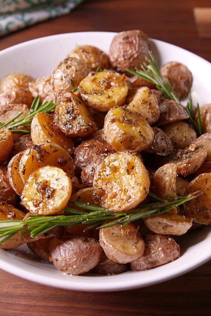 <p>The perfect side no matter what you'll be making.</p><p>Get the <a href="https://www.delish.com/uk/cooking/recipes/a28786013/rosemary-roasted-potatoes-recipe/" rel="nofollow noopener" target="_blank" data-ylk="slk:Rosemary Roasted Potatoes;elm:context_link;itc:0;sec:content-canvas" class="link ">Rosemary Roasted Potatoes</a> recipe.</p>