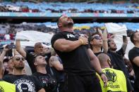 Spectators stand on the tribune during the Euro 2020 soccer championship group F match between Hungary and Portugal at the Ferenc Puskas stadium in Budapest, Hungary Monday, June 15, 2021. (AP Photo/Darko Bandic, Pool)