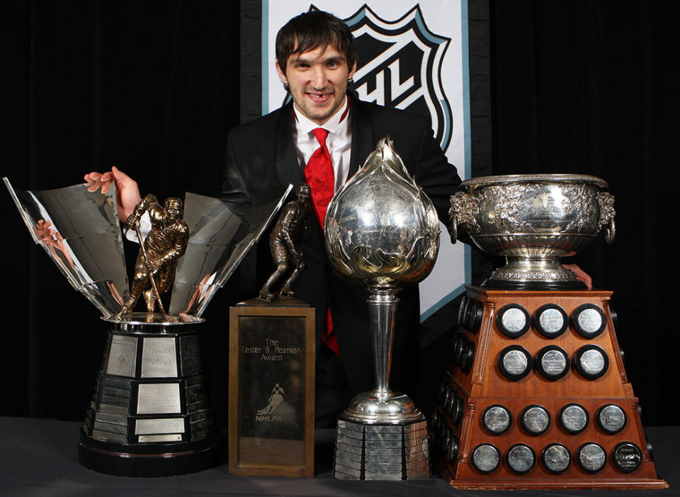 <p>Alexander Ovechkin of the Washington Capitals poses with the Hart Memorial Trophy, the Lester B. Pearson Award, the Art Ross Trophy, and the Maurice “Rocket” Richard Trophy during the 2008 NHL Awards at the Elgin Theatre on June 12, 2008 in Toronto, Canada. ( Photo by Claus Andersen/Getty Images) </p>