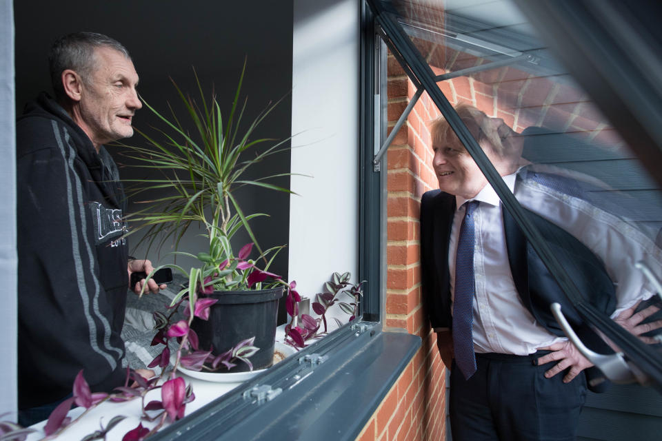 Prime Minister Boris Johnson (right) speaks to Paul O'Rourke, who served with the Royal Irish Rangers, during a visit to a veterans centre in Salisbury, whilst on the General Election campaign trail. PA Photo. Picture date: Tuesday December 3, 2019. See PA story POLITICS Election. Photo credit should read: Stefan Rousseau/PA Wire