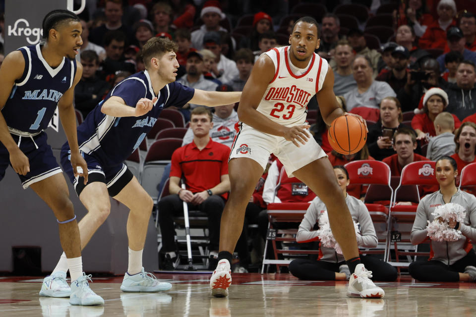 Ohio State's Zed Key, right, posts up against Maine's Ata Turgut during the first half of an NCAA college basketball game on Wednesday, Dec. 21, 2022, in Columbus, Ohio. (AP Photo/Jay LaPrete)