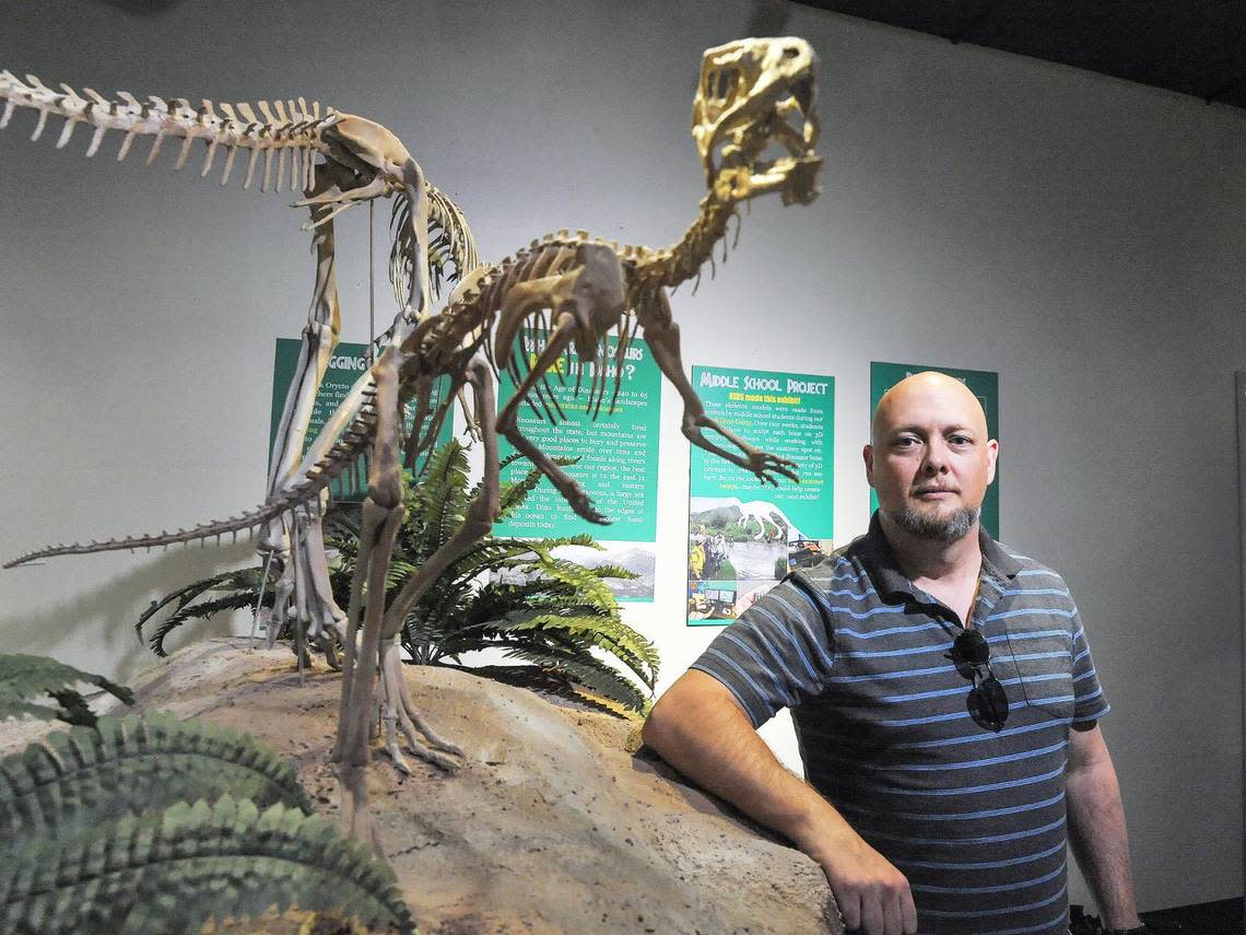 Idaho State University professor L. J. Krumenacker is shown with a skeleton of Oryctodromeus cubicularis.