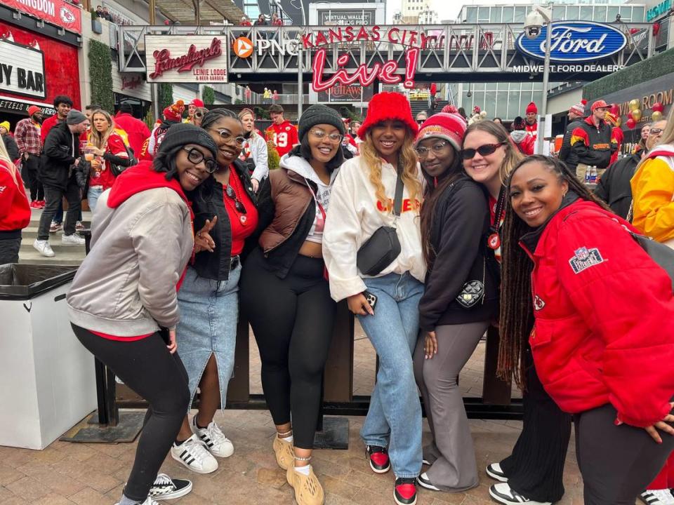 Gabby Simms, 27, at right, and her friends donned red and yellow and arrived at Kansas City’s Power & Light District around noon to enjoy the Super Bowl Watch party. 