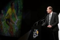 Tour de France director Christian Prudhomme speaks as five time tour de France winner Bernard Hinault is seen on a giant screen during the presentation of the itinerary of the 2017 Tour de France cycling race in Paris, France, October 18, 2016. REUTERS/Benoit Tessier